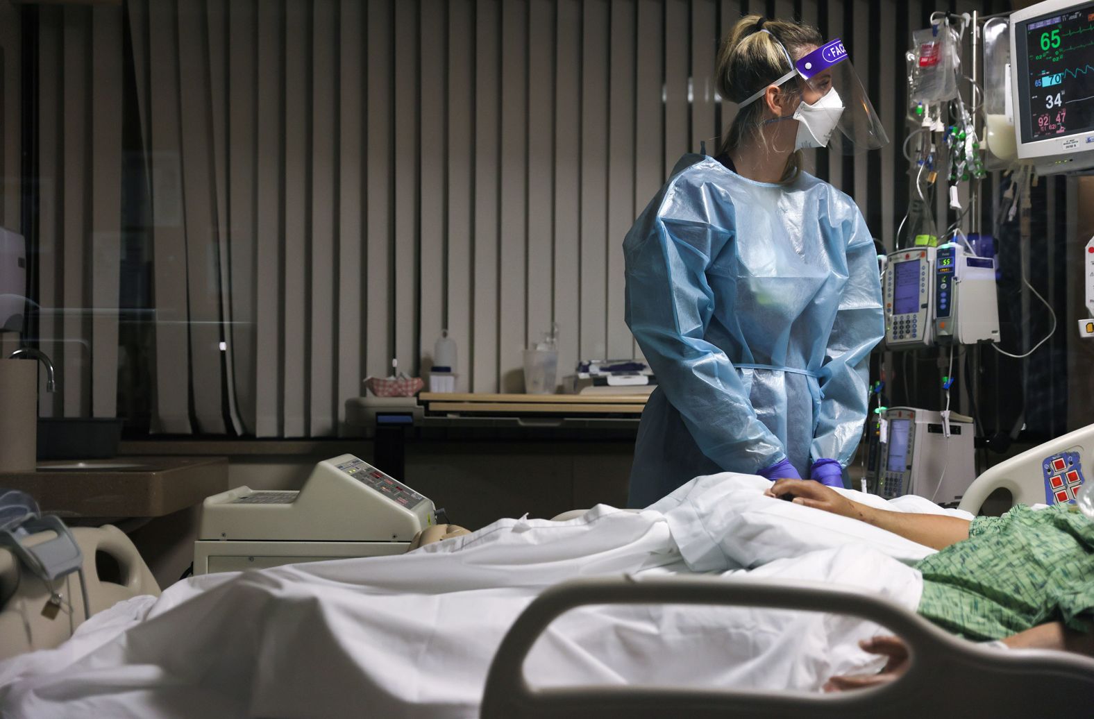 Registered nurse Tricia Cook cares for a Covid-19 patient January 5 at the Providence St. Mary Medical Center in Apple Valley, California.