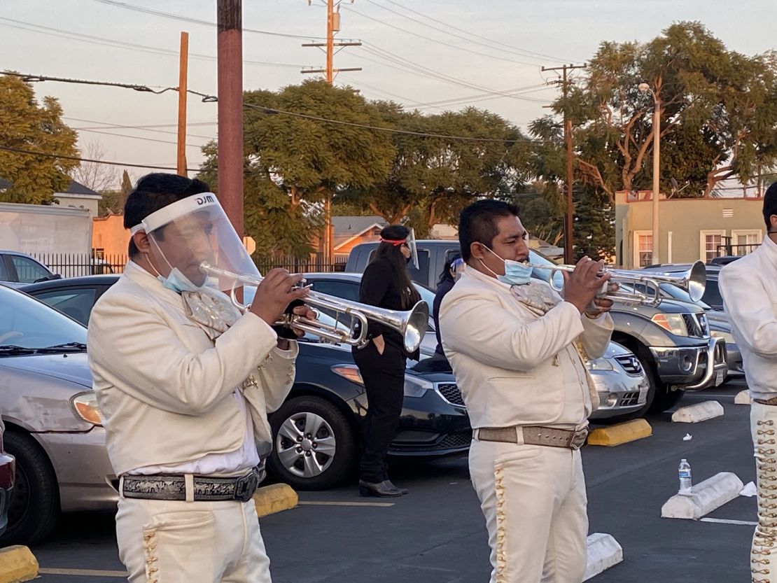 The mariachi band that played at the funeral in the parking lot.