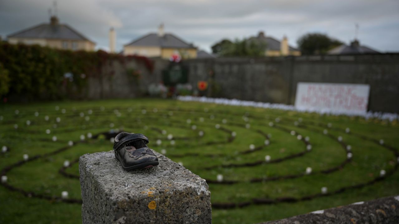 A baby shoe is seen at the Tuam site in Ireland's County Galway during a 2019 vigil.
