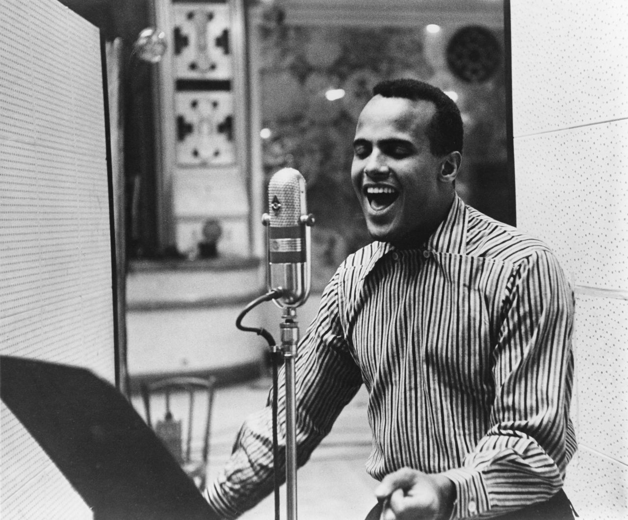 Belafonte performs in a recording studio circa 1957.