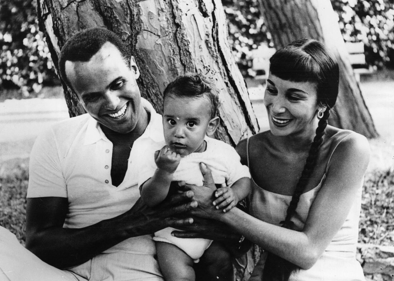 Belafonte enjoys a short holiday with his wife, Julie, and their 9-month-old son, David, near Genoa, Italy, in 1958.