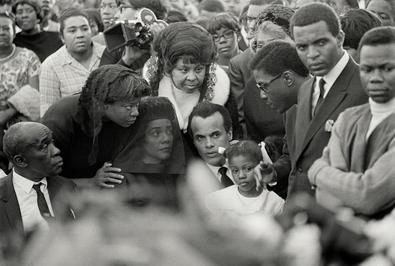 Belafonte sits next to Coretta Scott King, Martin Luther King Jr.'s widow, at her husband's funeral in 1968.