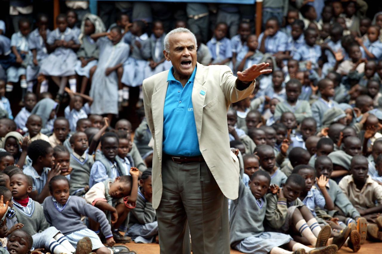 Belafonte addresses schoolchildren on the outskirts of Nairobi, Kenya, in 2004. Belafonte was urging nations to fund their own free education programs instead of relying on unfulfilled promises from richer nations.