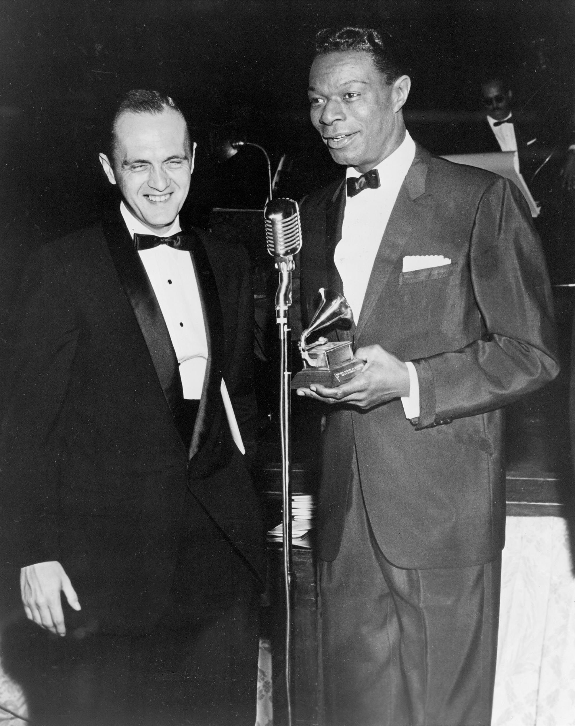 Newhart and singer Nat 'King' Cole appear together at the Grammy Awards in 1960. Newhart beat out Cole, Frank Sinatra and Harry Belafonte for album of the year.