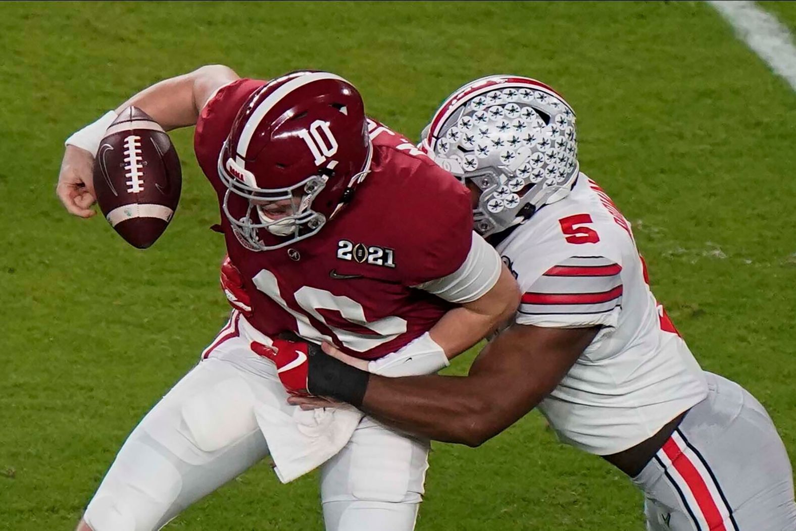 Ohio State linebacker Baron Browning forces Jones to fumble in the first half.