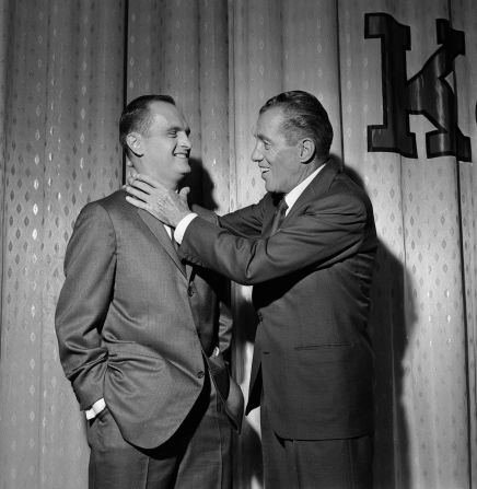 Talk-show host Ed Sullivan pretends to grab Newhart around the neck in 1960.