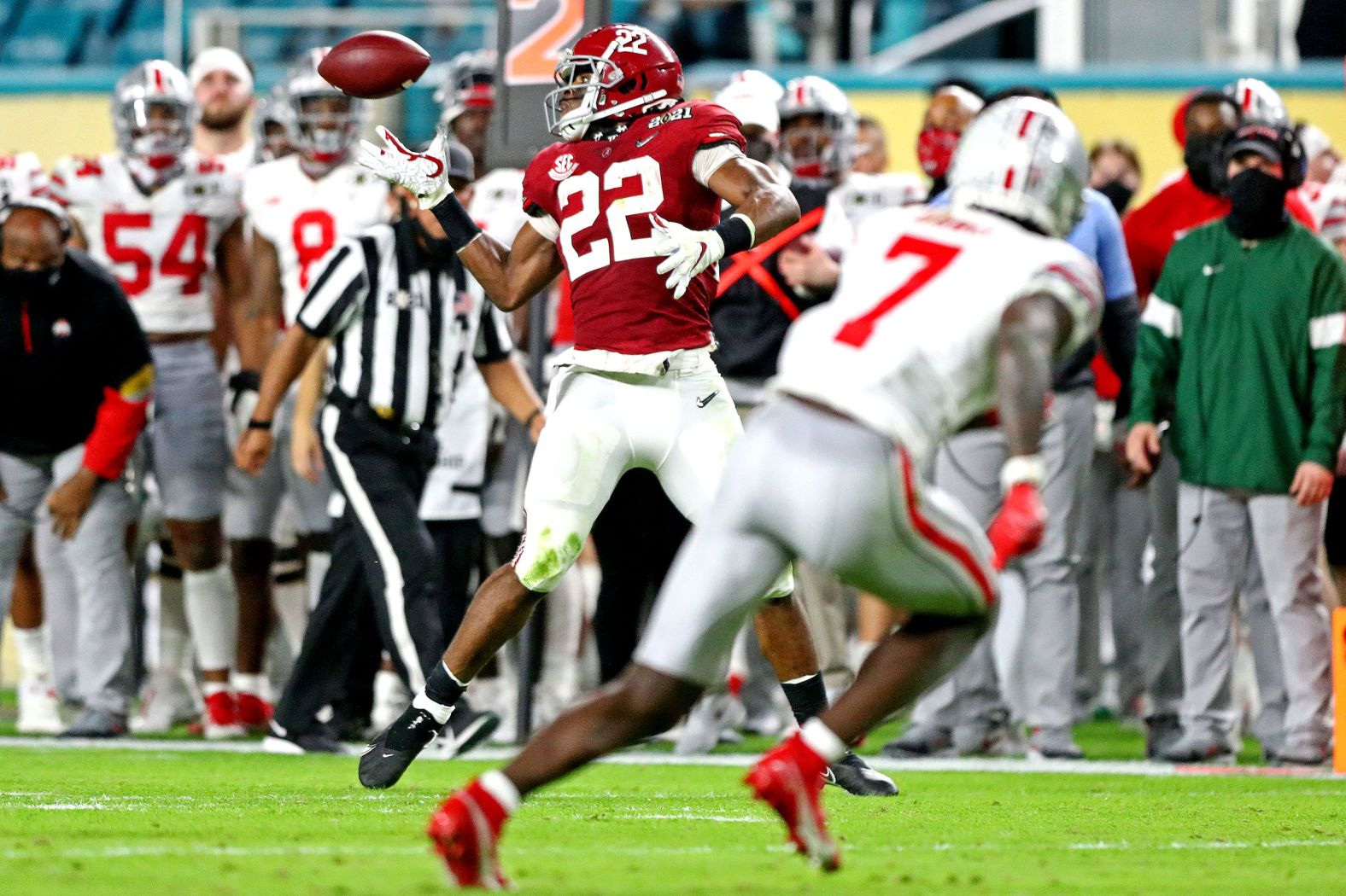 Harris reaches back to make a catch before rumbling in for a 26-yard touchdown in the second quarter.