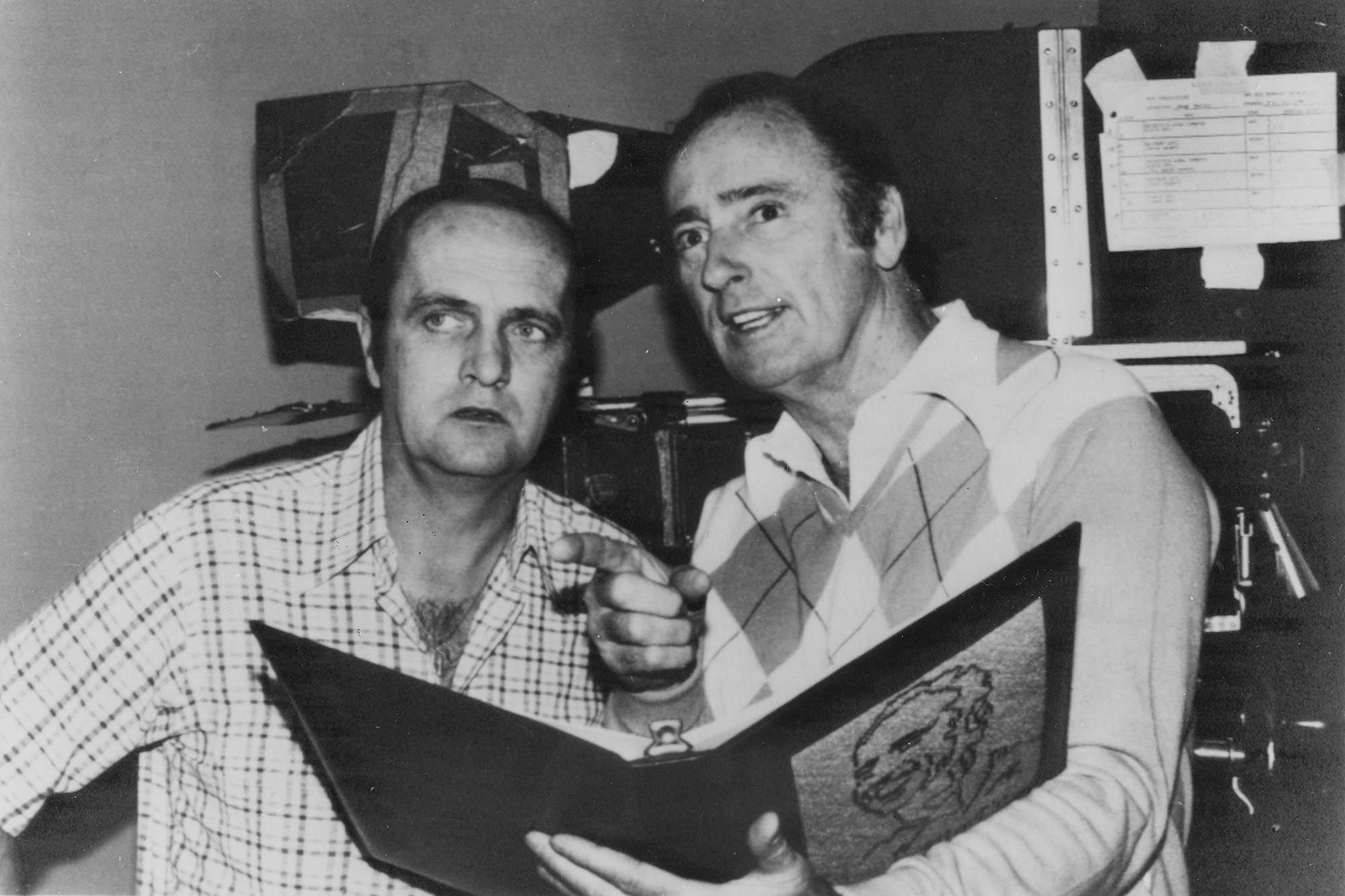 Newhart takes direction from Dick Martin during a scene for 'The Bob Newhart Show' in 1977.