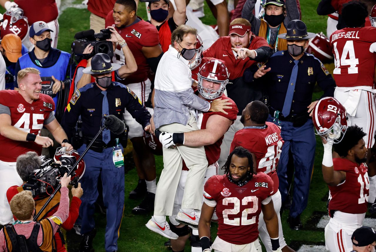 Saban is carried by offensive lineman Landon Dickerson after the final whistle. This is Saban's sixth title with the Crimson Tide. It is his seventh title overall, counting a championship with LSU. No college coach has won more.