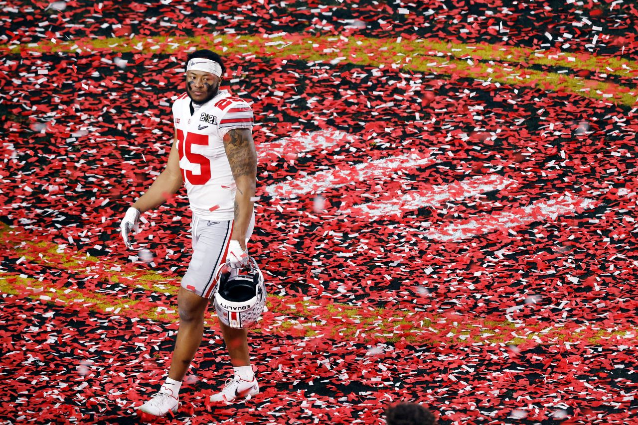 Ohio State's Xavier Johnson leaves the confetti-filled field after the game.