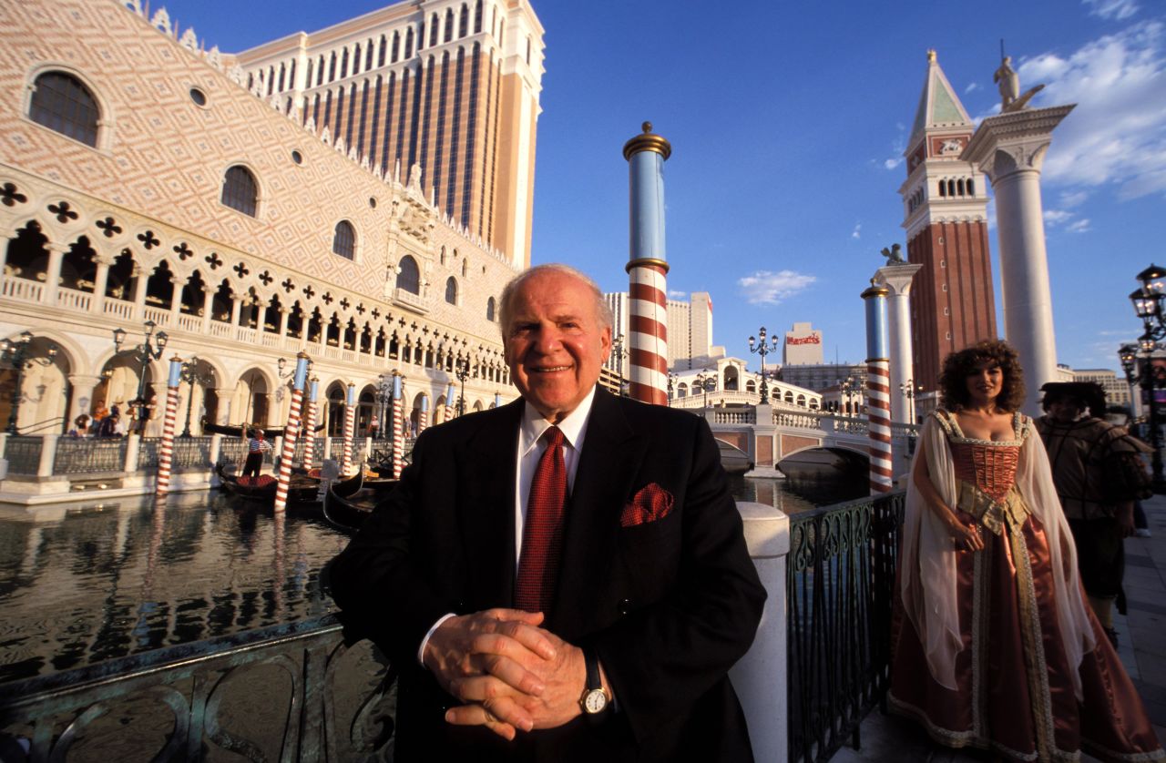 Adelson poses in front of The Venetian in Las Vegas. His big break came in the late 1970s, when he launched a computer trade show known as Comdex. He sold it in 1995 for nearly $900 million, parlaying that convention business into a casino empire that comprises properties in Las Vegas and Asia.