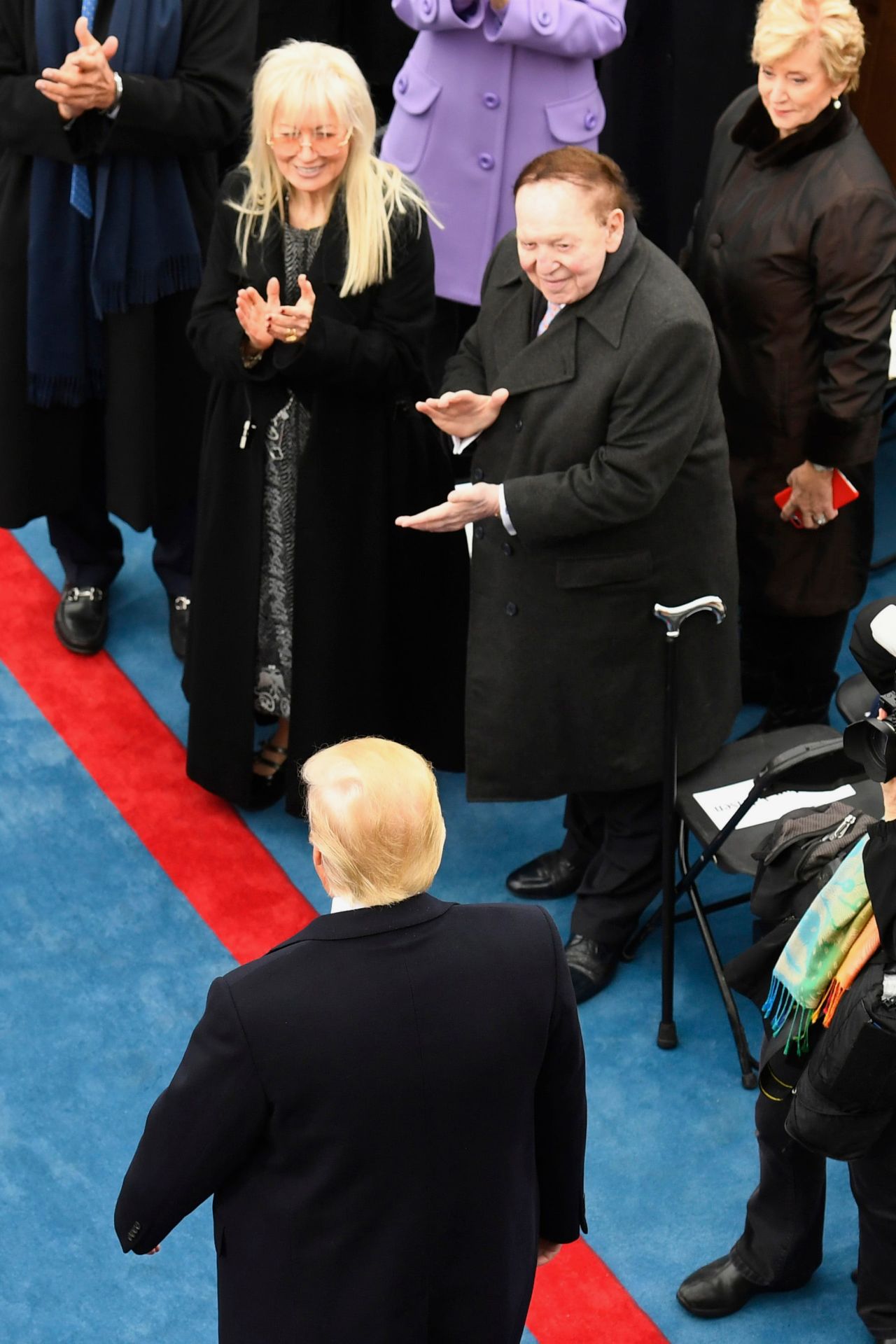 The Adelsons applaud President-elect Donald Trump at Trump's inauguration in 2017. Sheldon Adelson backed Trump when many traditional GOP donors were reluctant to support the candidate.