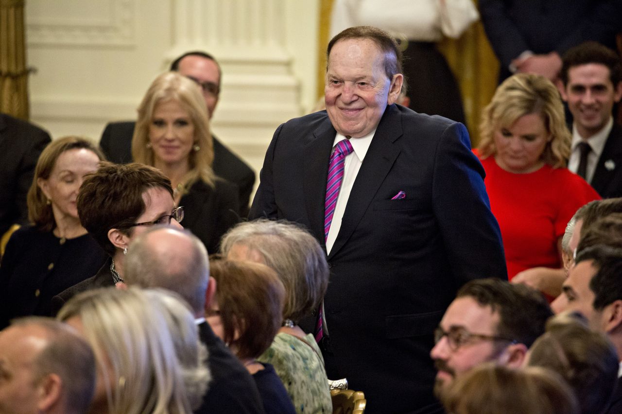 Adelson stands in the East Room of the White House during a Presidential Medal of Freedom ceremony in 2018. Trump was awarding Adelson's wife, Miriam, with the nation's highest civilian honor.