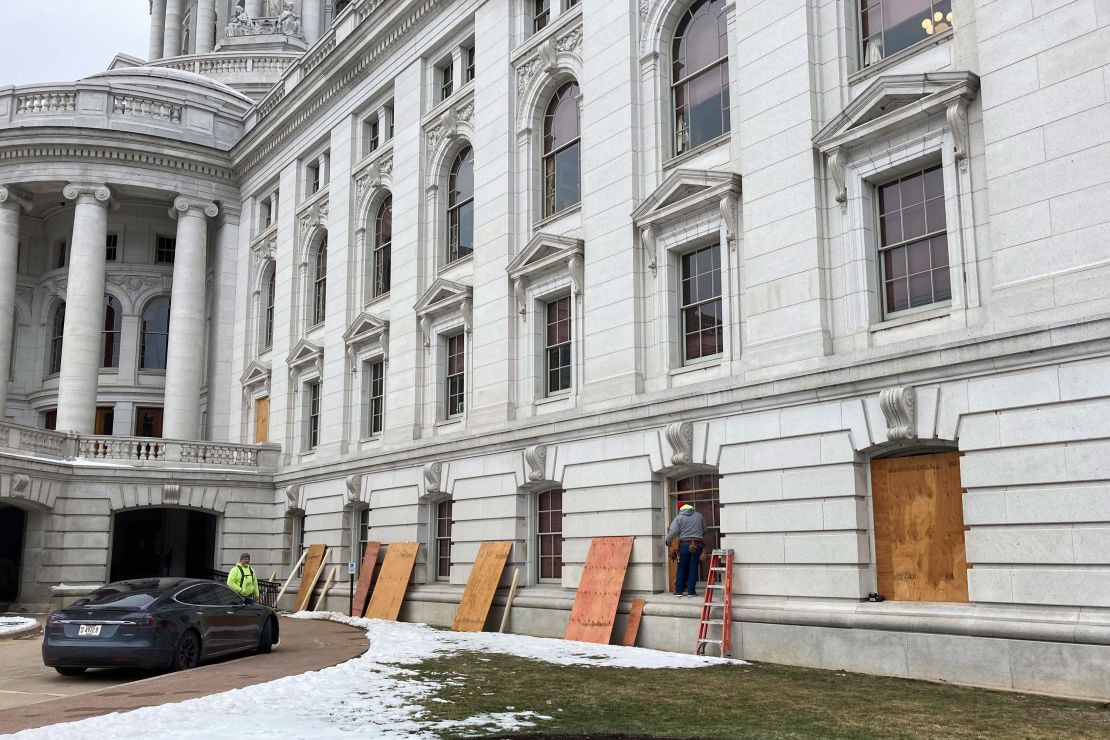 Workers boarded up the Wisconsin Capitol building in Madison on Monday.