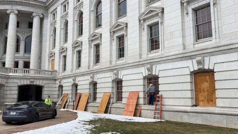 Workers boarded up the Wisconsin Capitol building in Madison on Monday.