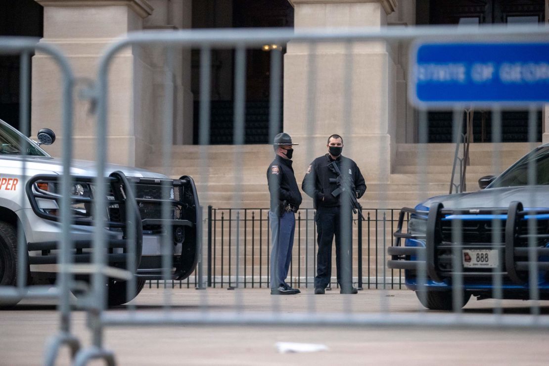 Georgia state troopers stand guard outside the Georgia Capitol in downtown Atlanta on the first day of the 2021 legislative session on Monday, January 11.