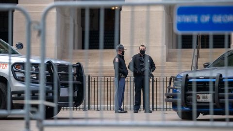Georgia state troopers stand guard outside the Georgia Capitol in downtown Atlanta on the first day of the 2021 legislative session on Monday, January 11.