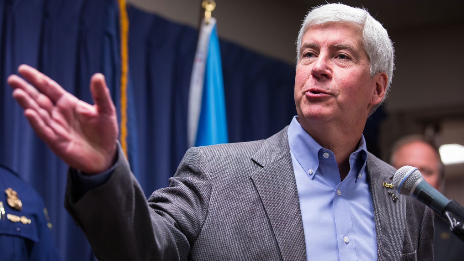Former Michigan Gov. Rick Snyder speaks to the media regarding the status of the Flint water crisis on January 27, 2016, in Flint, Michigan.  