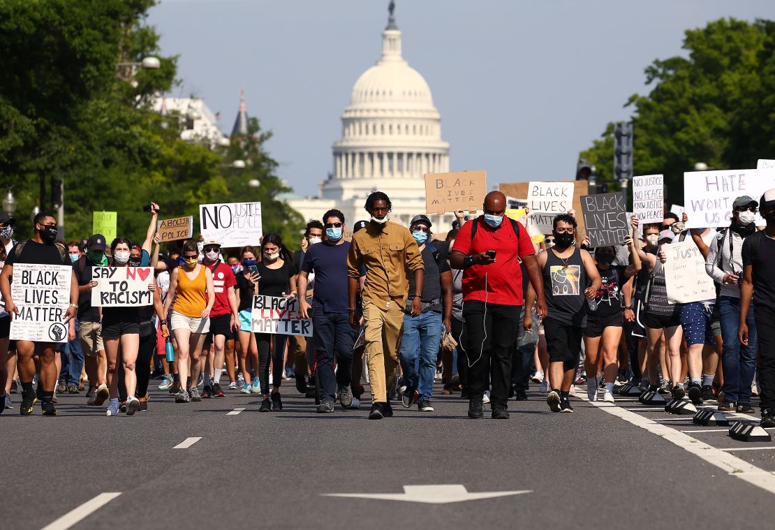 Demonstrators march down Pennsylvania Avenue during a protest against police brutality following the murder of George Floyd, on June 3, 2020, in Washington, DC.