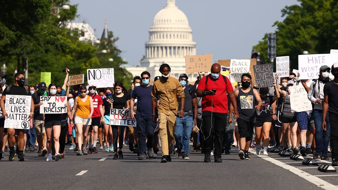 Demonstrators march down Pennsylvania Avenue during a protest against police brutality following the murder of George Floyd, on June 3, 2020, in Washington, DC.