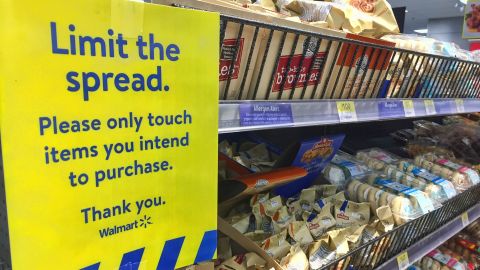 A sign at a Walmart store in Toronto on January 8, 2021, urges customers to touch only items they intend to purchase.