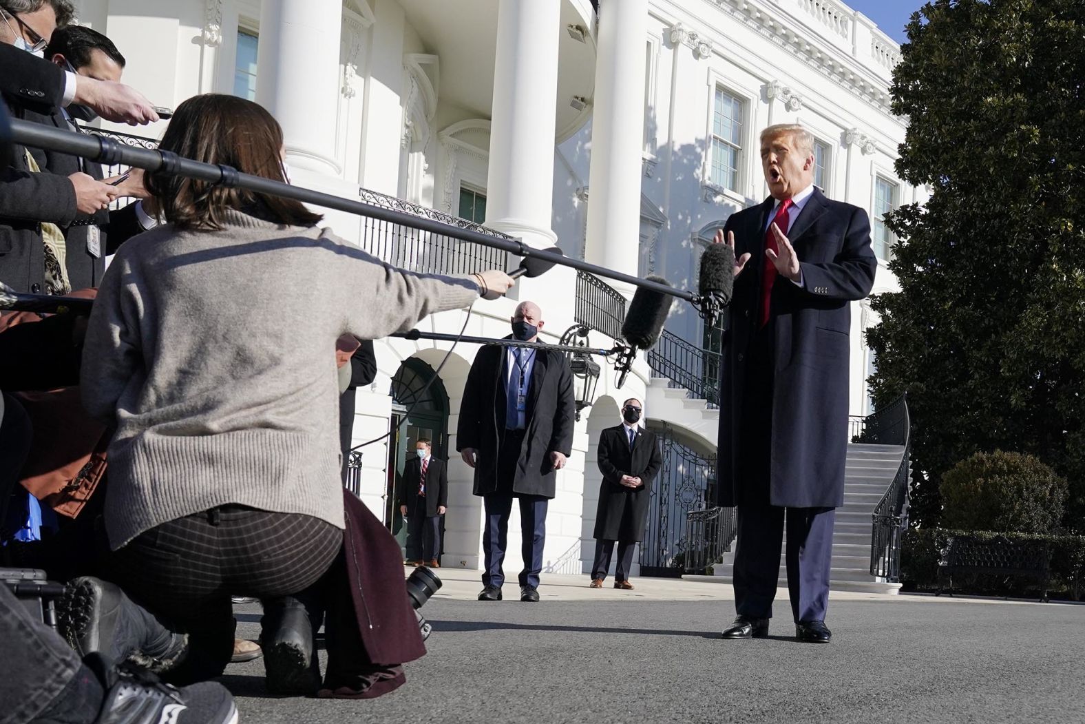 Trump talks to the media at the White House one day before <a href="index.php?page=&url=http%3A%2F%2Fwww.cnn.com%2F2021%2F01%2F13%2Fpolitics%2Fgallery%2Ftrump-second-impeachment%2Findex.html" target="_blank">he was impeached for a second time.</a> Ten House Republicans joined House Democrats in voting for impeachment, exactly one week after pro-Trump rioters ransacked the US Capitol. The impeachment resolution charged Trump with "incitement of insurrection." <a href="index.php?page=&url=https%3A%2F%2Fwww.cnn.com%2F2021%2F01%2F12%2Fpolitics%2Fdonald-trump-riot-impeachment%2Findex.html" target="_blank">Trump likened the impeachment push to a "witch hunt."</a> He said the speech he gave to his supporters on January 6, the day the Capitol was breached, was "totally appropriate." He was acquitted on February 12, 2021.