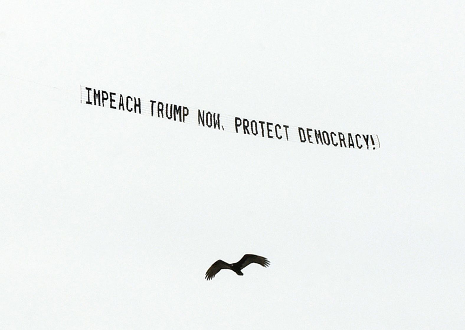 A banner flies over Orlando on January 7, calling for Trump's impeachment.