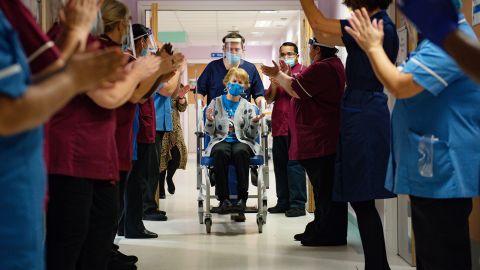 Margaret Keenan, 90, is applauded by staff after becoming the first person in the United Kingdom to receive the Pfizer/BioNtech Covid-19 vaccine at University Hospital in Coventry, December 8, 2020.