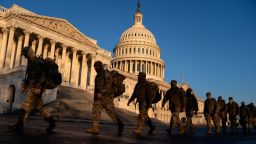 WASHINGTON, DC - JANUARY 12: Members of the National Guard gather outside the U.S. Capitol on January 12, 2021 in Washington, DC. Today the House of Representatives plans to vote on Rep. Jamie Raskin's (D-MD) resolution calling on Vice President Mike Pence to invoke the 25th Amendment, removing President Trump from office. Wednesday, House Democrats plan on voting on articles of impeachment. (Photo by Stefani Reynolds/Getty Images)