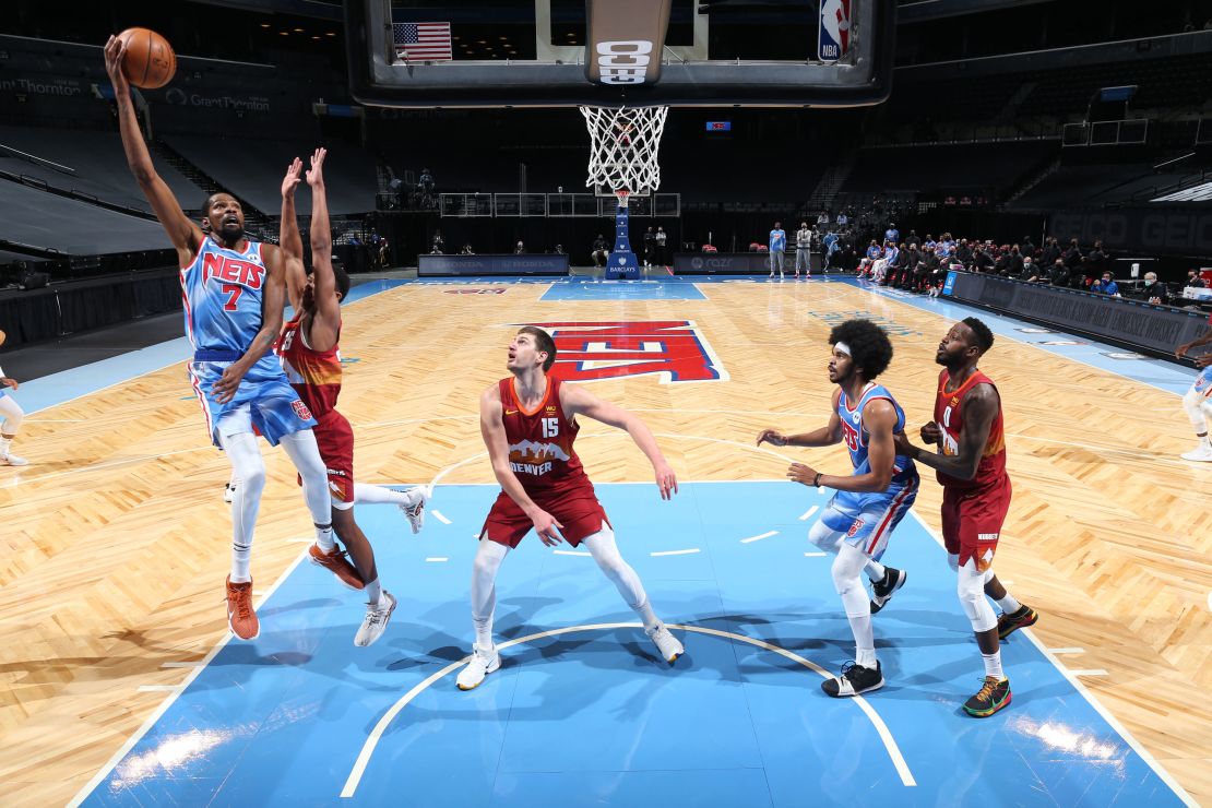 Durant shoots the ball during the game against the Denver Nuggets.