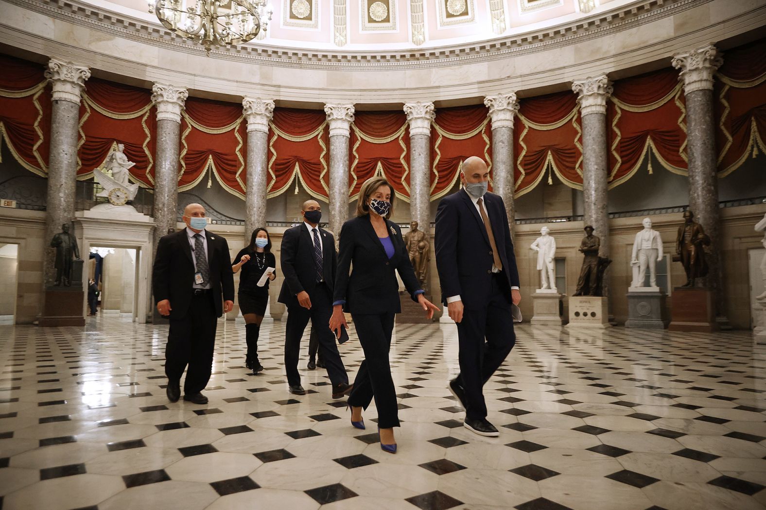 Pelosi heads to the House chamber for the last vote of the day on January 12. The House approved a resolution urging Vice President Mike Pence to <a href="https://www.cnn.com/2021/01/12/politics/house-vote-25th-amendment-trump/index.html" target="_blank">invoke the 25th Amendment</a> to remove Trump from power, but Pence sent a letter ahead of the vote saying he would not do so.