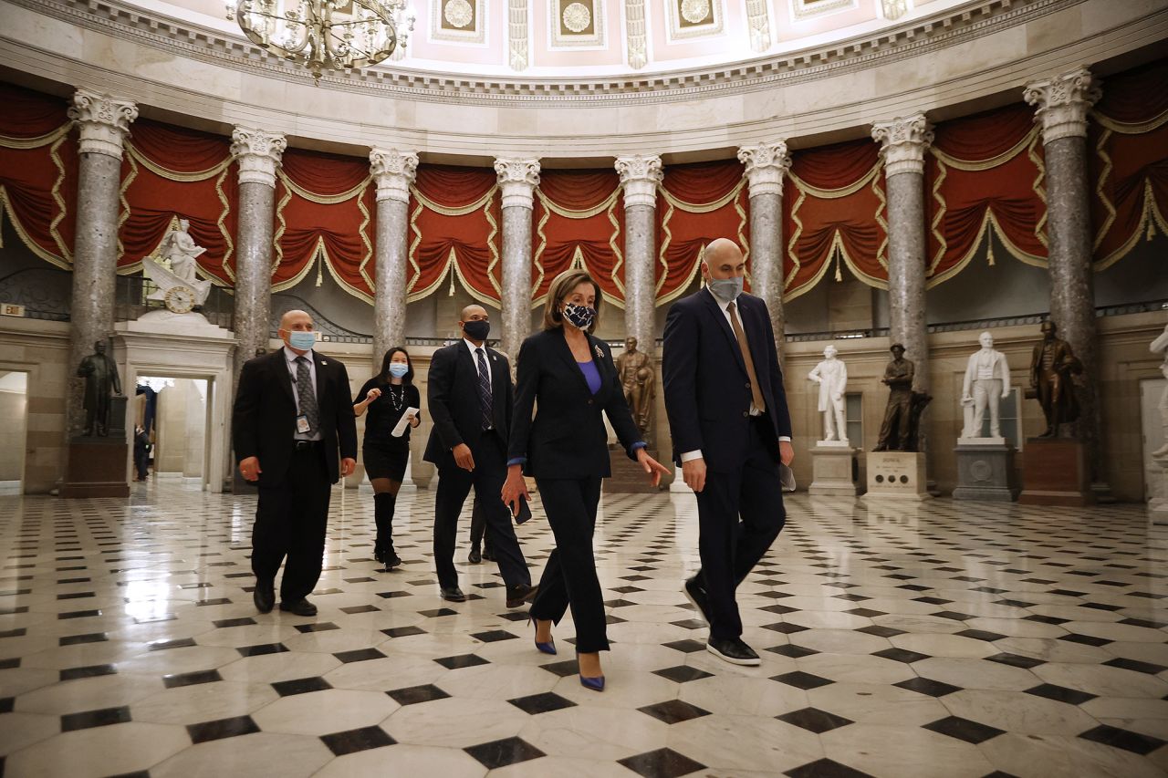 Pelosi heads to the House chamber for the last vote of the day on January 12. The House approved a resolution urging Vice President Mike Pence to <a href="https://www.cnn.com/2021/01/12/politics/house-vote-25th-amendment-trump/index.html" target="_blank">invoke the 25th Amendment</a> to remove Trump from power, but Pence sent a letter ahead of the vote saying he would not do so.