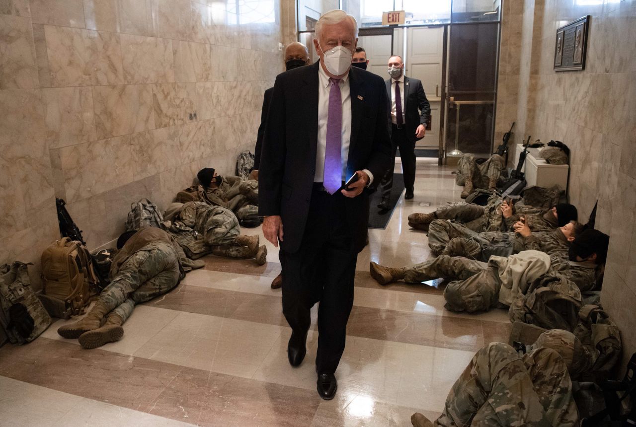 House Majority Leader Steny Hoyer walks past members of the National Guard as he arrives at the US Capitol on January 13.