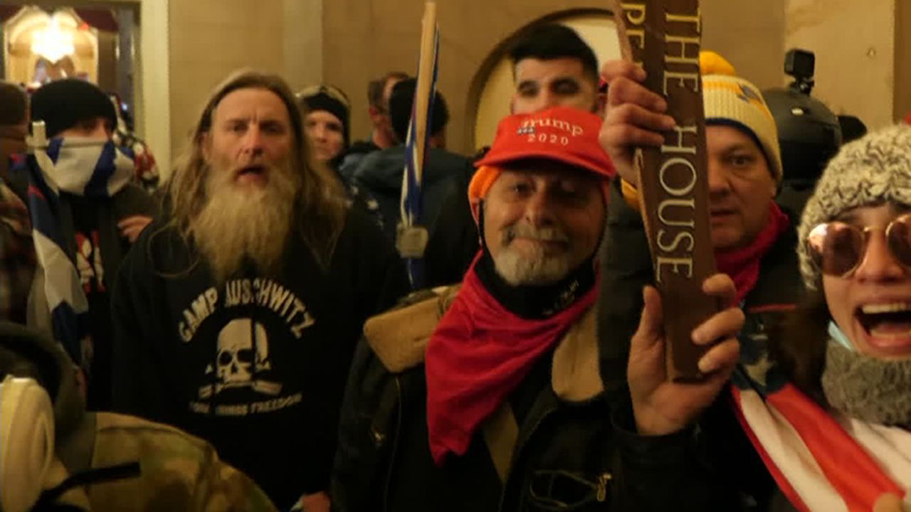 The rioter who stormed the US Capitol Wednesday wearing a sweatshirt emblazoned with the phrase "Camp Auschwitz", identified as Robert Keith Packer of Virginia, was arrested Wednesday morning in Virginia, according to a law enforcement official.