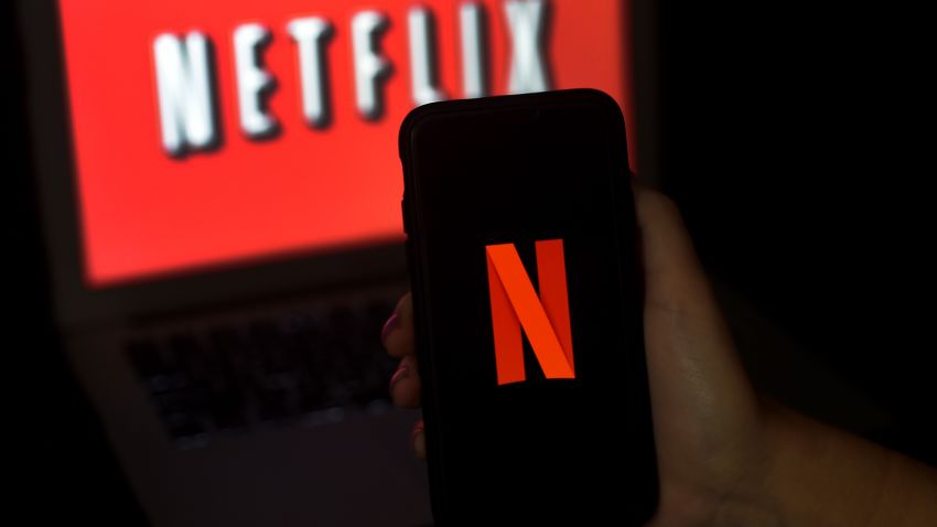 In this photo illustration a computer screen and mobile phone display the Netflix logo on March 31, 2020 in Arlington, Virginia. - According to Netflix chief content officer Ted Sarandos, Netflix viewership is on the rise during the coronavirus outbreak. (Photo by Olivier DOULIERY / AFP) (Photo by OLIVIER DOULIERY/AFP via Getty Images)