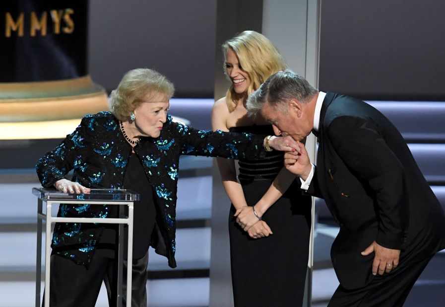 Alec Baldwin kisses White's hand at the Emmy Awards in 2018.
