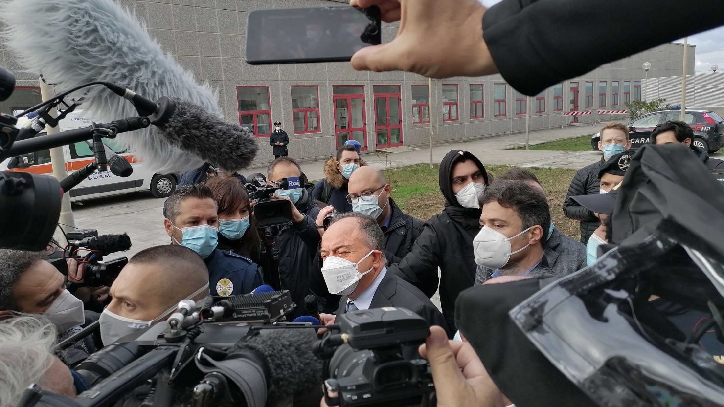 Italian anti-mafia prosecutor Nicola Gratteri, center, is surrounded by media as he arrives for the opening of the trial of more than 350 alleged members of the 'Ndrangheta mafia group and their associates in Calabria.