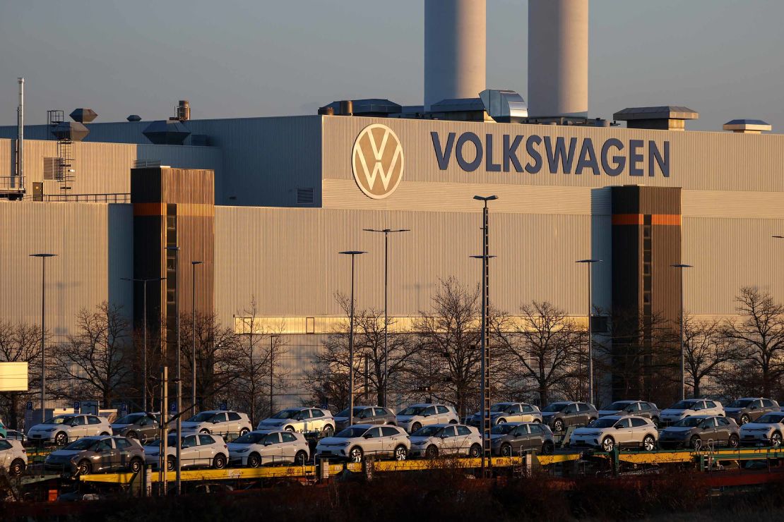 Trains with electric vehicles stand in front of the Volkswagen plant in Zwickau. The company is producing its first electric SUV at the factory. 