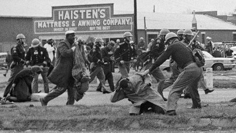 State troopers swing billy clubs to break up a voting rights march in Selma, Alabama, in 1965. Future congressman John Lewis, then chairman of the Student Nonviolent Coordinating Committee, is being beaten by a state trooper in the foreground.
