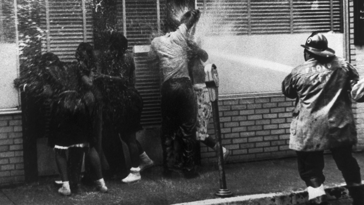 Firemen train their hoses on a group of African Americans while routing anti-segregation demonstrators in Birmingham, Alabama, in May 1963.