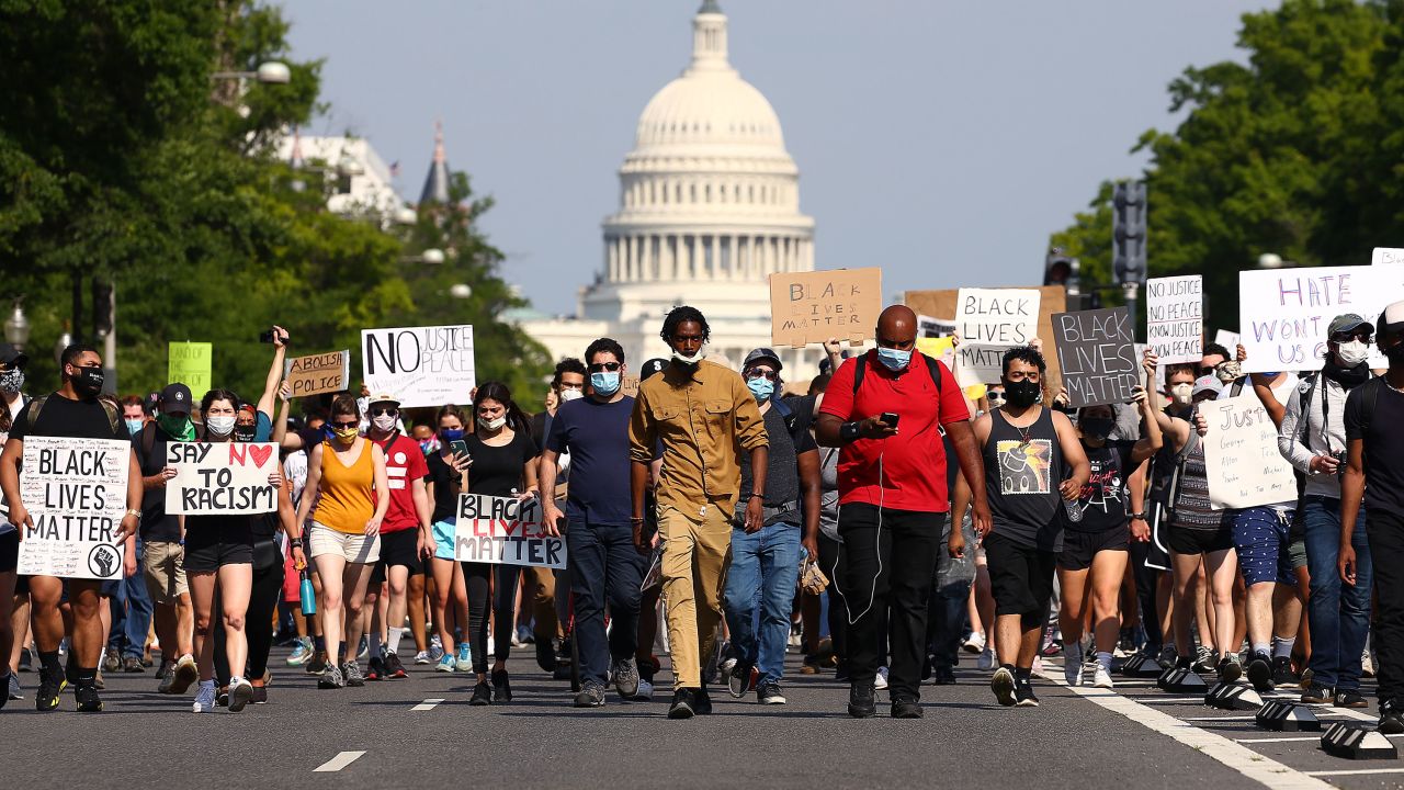 Demonstrators march down Pennsylvania Avenue during a protest against police brutality and the death of George Floyd, on June 3, 2020 in Washington.