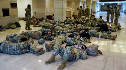 National Guard members sleep in the Capitol Vistor's Center on Capitol Hill before Democrats begin debating one article of impeachment against U.S. President Donald Trump at the U.S. Capitol, in Washington, U.S., January 13, 2021. REUTERS/Joshua Roberts