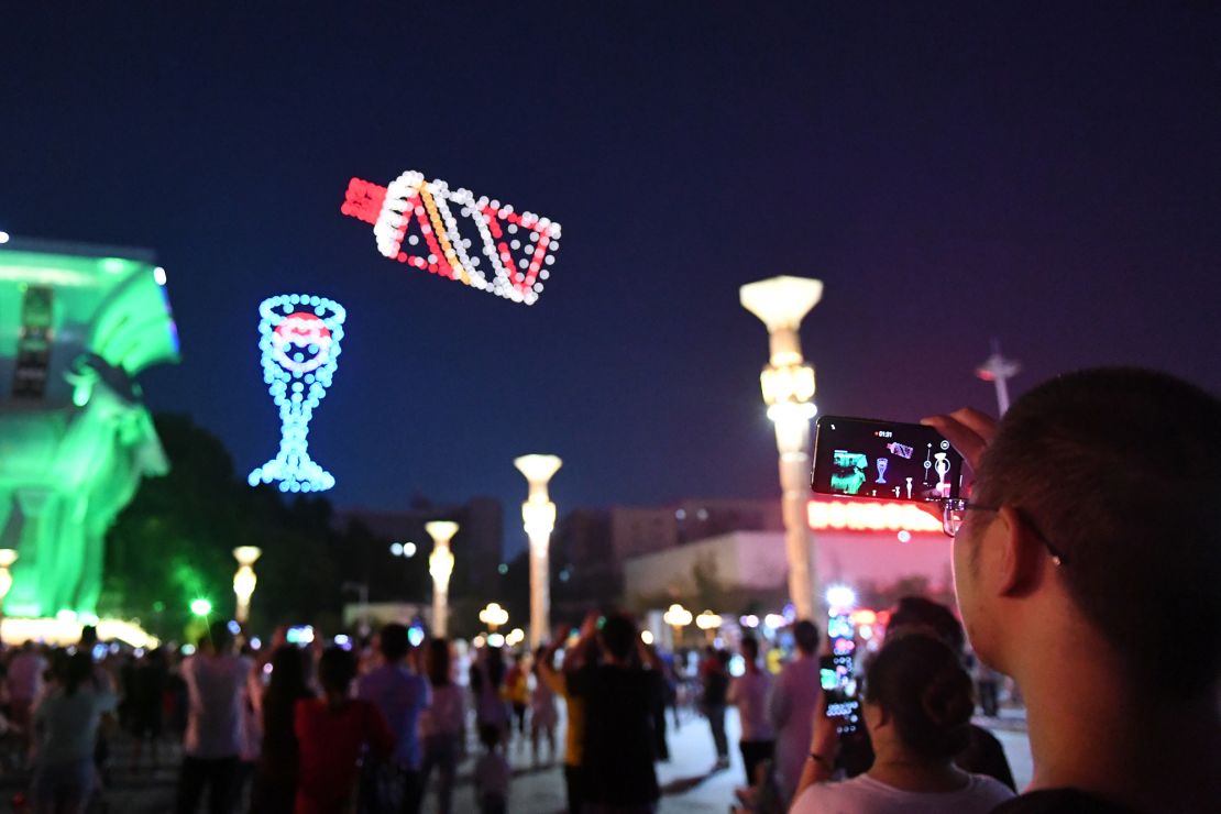 800 drones perform in teams in the night sky to form a "Moutai wine bottle" pattern in Renhuai, Guizhou, China in June 2020.