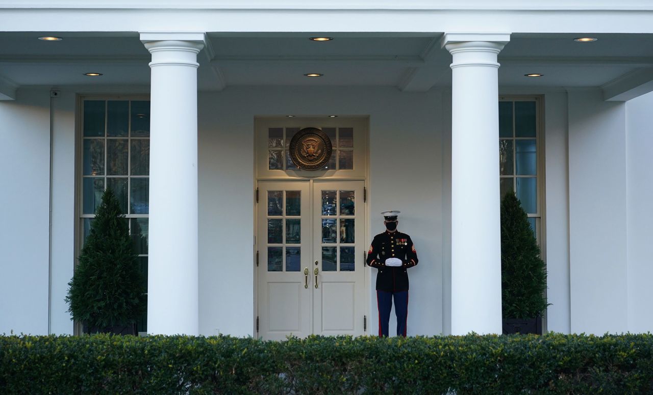 A US Marine is seen outside of the West Wing of the White House, signifying that Trump was in the Oval Office when the House was voting on impeachment.