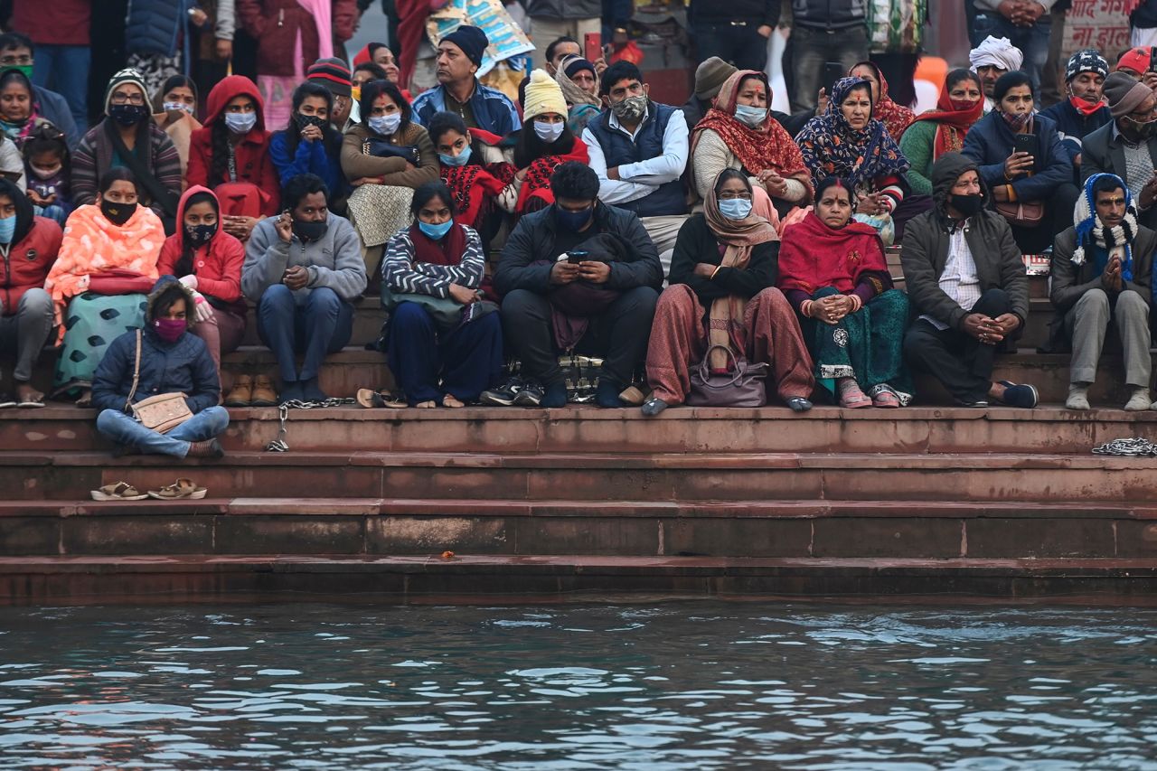 Hindu devotees attend evening prayers on the banks of the River Ganges on January 13.