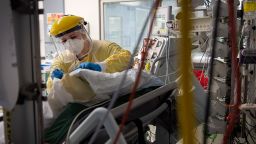 A nurse works with a patient inside the Intensive Care Unit at St George's Hospital in London, on Wednesday January 6