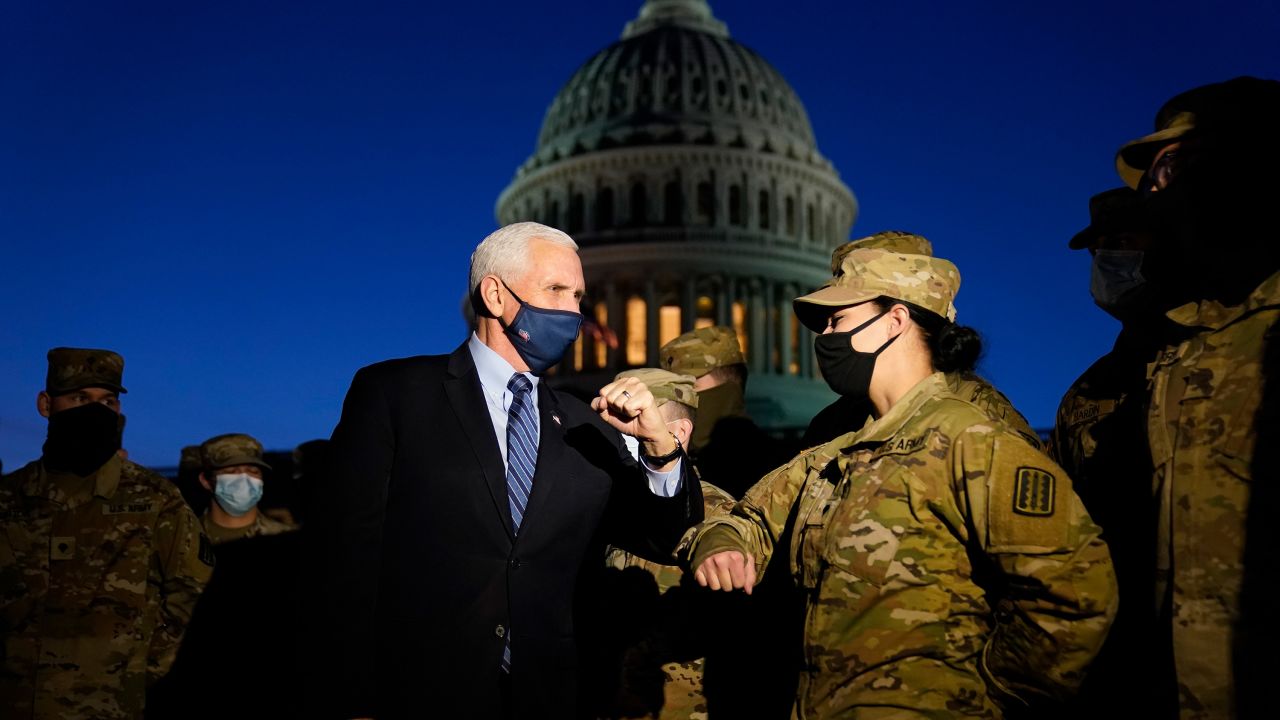 Vice President Mike Pence visits with National Guard members outside the US Capitol on Thursday, January 14, in Washington, DC. 