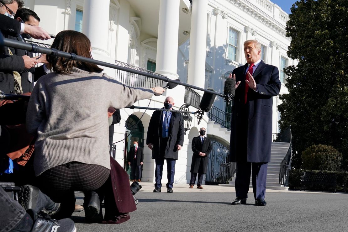 President Donald Trump talks to the media before boarding Marine One on the South Lawn of the White House, Tuesday, Jan. 12, 2021 in Washington, DC.