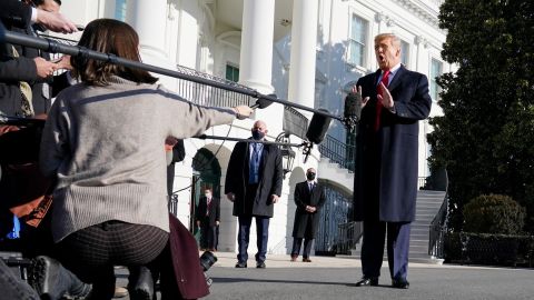 President Donald Trump talks to the media before boarding Marine One on the South Lawn of the White House, Tuesday, Jan. 12, 2021 in Washington, DC.