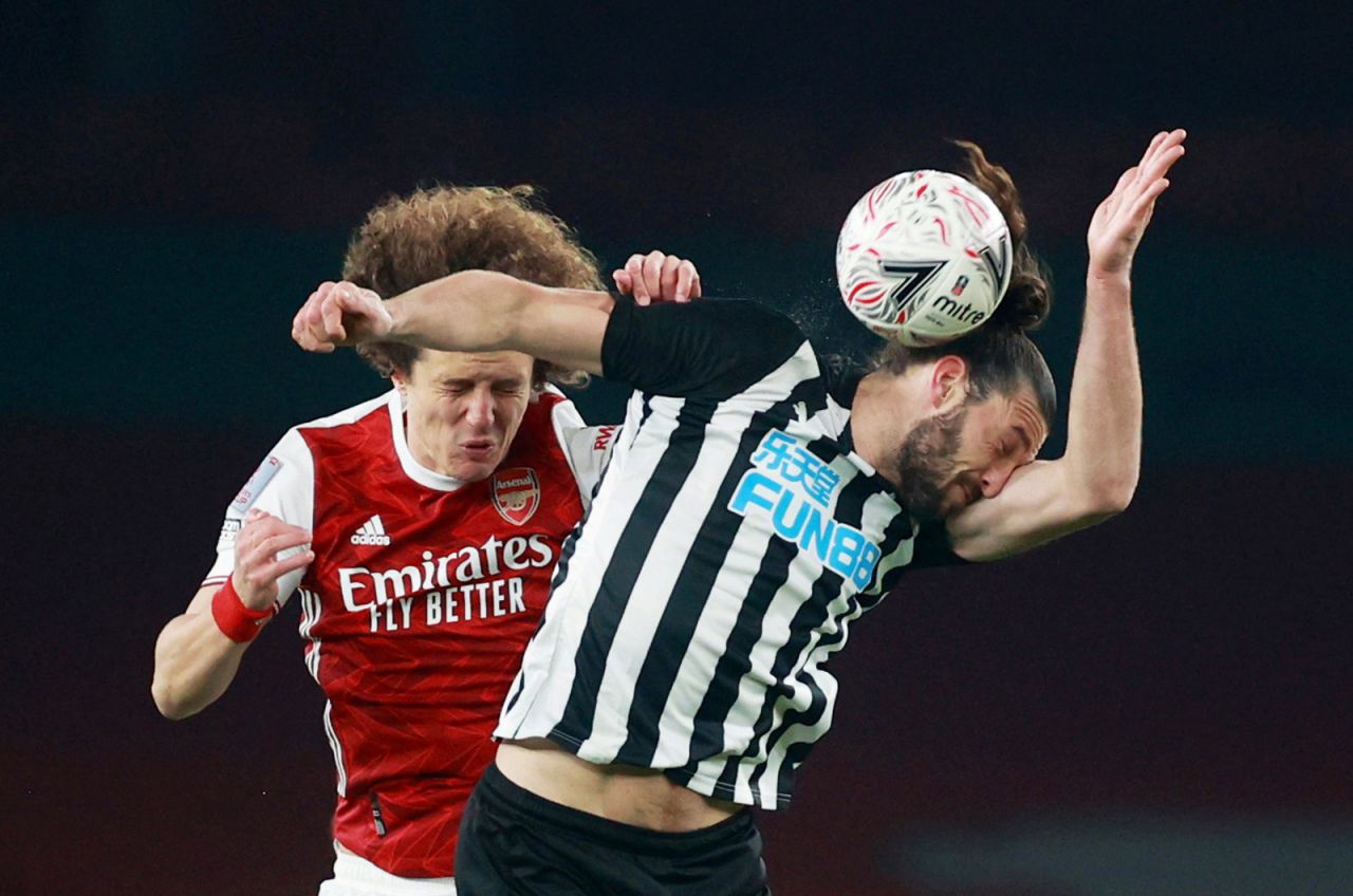 Arsenal's David Luiz and Newcastle United's Andy Carroll fight for the ball during a game on Saturday, January 9, in London. 